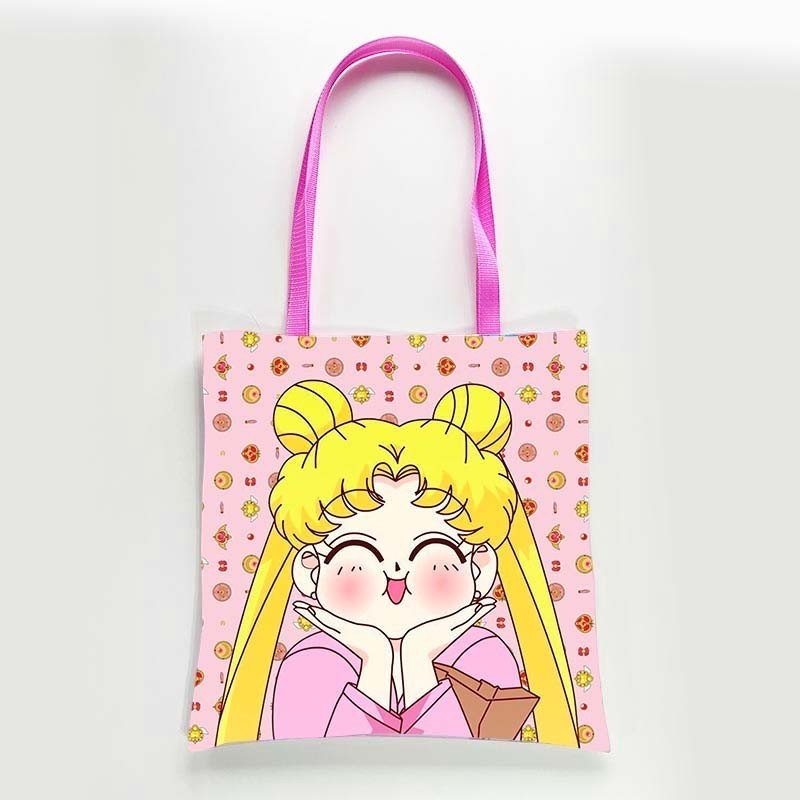 dfpbfriends Sailor Moon pink canvas tote bag with waterproof lining and pink straps. Features a cute anime character print.